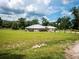 Spacious home on a large lot, featuring a well-maintained lawn and mature trees at 485 Nw 71St Ave, Ocala, FL 34482
