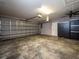 Spacious garage featuring a large overhead door, ample storage cabinets and neutral gray color scheme at 485 Nw 71St Ave, Ocala, FL 34482