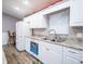 Functional kitchen features stainless steel appliances, granite countertops, and a double sink with a view to the exterior at 485 Nw 71St Ave, Ocala, FL 34482