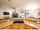 Kitchen featuring a breakfast bar, a sink, and an open view into the adjacent living room at 485 Nw 71St Ave, Ocala, FL 34482
