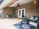 Covered patio with stylish outdoor furniture, perfect for entertaining at 485 Nw 71St Ave, Ocala, FL 34482