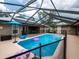 Enclosed pool with safety fence, patio seating and a clear dome create a backyard oasis at 485 Nw 71St Ave, Ocala, FL 34482