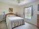 Neutrally decorated bedroom features a cozy space, with light carpet and natural light at 517 Westwind Dr, Davenport, FL 33896