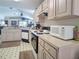 Bright kitchen with white cabinetry, efficient appliances, and ample counter space at 517 Westwind Dr, Davenport, FL 33896