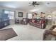 Spacious living room featuring plush furnishings, bright natural light, and an open floor plan at 517 Westwind Dr, Davenport, FL 33896