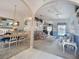 Inviting living room with comfortable seating, stylish decor, and an open layout to the dining area at 517 Westwind Dr, Davenport, FL 33896