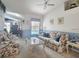 Cozy living room with comfortable seating, charming decor, and views of the backyard at 517 Westwind Dr, Davenport, FL 33896