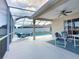 Inviting screened-in pool and patio area, perfect for outdoor entertaining and relaxation at 517 Westwind Dr, Davenport, FL 33896