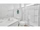 Clean and modern bathroom with a glass-enclosed shower, vanity, and neutral color scheme at 518 Marcello Blvd, Kissimmee, FL 34746
