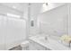 Minimalist bathroom featuring a white vanity, toilet, shower with curtain, and a large mirror at 518 Marcello Blvd, Kissimmee, FL 34746