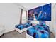 Charming bedroom with twin beds, 'Frozen' themed decor, and ample natural light at 518 Marcello Blvd, Kissimmee, FL 34746