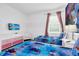 Bright bedroom with twin beds, dresser, TV and 'Frozen' themed decor, perfect for  at 518 Marcello Blvd, Kissimmee, FL 34746