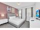 Serene bedroom with a luxurious bed, soft lighting, and sophisticated decor at 518 Marcello Blvd, Kissimmee, FL 34746