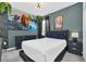 Cozy bedroom featuring an Avatar-themed mural, stylish decor, and a comfortable bed at 518 Marcello Blvd, Kissimmee, FL 34746