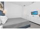 Clean bedroom features a comfortable bed, dresser, and a TV at 518 Marcello Blvd, Kissimmee, FL 34746
