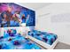Cozy bedroom with twin beds and 'Frozen' themed wallpaper for a magical touch at 518 Marcello Blvd, Kissimmee, FL 34746