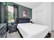 Comfortable bedroom featuring a large bed, Avatar poster, and coordinating bedside tables at 518 Marcello Blvd, Kissimmee, FL 34746