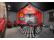 A luxurious game room featuring a foosball table, pool table, and a striking red and black color scheme at 518 Marcello Blvd, Kissimmee, FL 34746