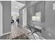 Welcoming hallway with sleek console table and decorative mirror, leading to the living areas at 518 Marcello Blvd, Kissimmee, FL 34746