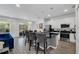 Open-concept kitchen with stainless steel appliances, a large island, and barstool seating at 518 Marcello Blvd, Kissimmee, FL 34746