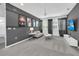 Living room features a TV, gray walls, stylish decor, and views of Justice League movie posters at 518 Marcello Blvd, Kissimmee, FL 34746
