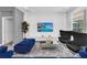 Bright living room boasts modern design, sleek furniture, large television, and sliding glass doors at 518 Marcello Blvd, Kissimmee, FL 34746