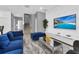 Spacious living room showcasing modern furniture, open floor plan, staircase, and textured feature wall at 518 Marcello Blvd, Kissimmee, FL 34746