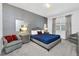 The main bedroom showcases elegant decor, stylish furniture, and a serene, inviting atmosphere at 518 Marcello Blvd, Kissimmee, FL 34746