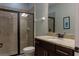 Modern bathroom featuring a glass-enclosed shower, granite countertop, and updated fixtures at 531 Lasso Dr, Kissimmee, FL 34747