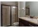 This bathroom features a shower with glass enclosure, granite countertop, and vanity with tile flooring at 531 Lasso Dr, Kissimmee, FL 34747