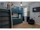 Fun room with custom bunk beds, overhead lighting, and a bean bag chair at 531 Lasso Dr, Kissimmee, FL 34747