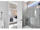 Modern bathroom with glass-enclosed shower and neutral tile at 5512 Settlingstone Ln, St Cloud, FL 34771