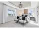 Comfortable bedroom featuring large windows, modern decor, and soft lighting at 5512 Settlingstone Ln, St Cloud, FL 34771