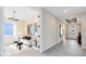 Bright living room with neutral walls, tiled floors, decor, and view to the foyer at 5512 Settlingstone Ln, St Cloud, FL 34771