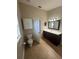 Full bathroom featuring a vanity, toilet, and ample storage space at 581 Farmingham Ct, Oviedo, FL 32765