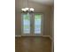 Dining area with tile flooring and French doors leading to patio at 581 Farmingham Ct, Oviedo, FL 32765