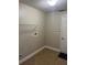 Laundry room with tile flooring and metal shelving at 581 Farmingham Ct, Oviedo, FL 32765