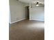 Spacious living room with neutral walls, tile flooring and a ceiling fan at 581 Farmingham Ct, Oviedo, FL 32765
