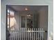 Enclosed back patio with white picket fence offers a serene outdoor space at 581 Farmingham Ct, Oviedo, FL 32765
