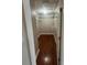 Walk-in closet featuring wood flooring and metal shelving at 581 Farmingham Ct, Oviedo, FL 32765