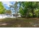 Spacious backyard with trees and foliage offers great potential for outdoor activities and landscaping at 657 Lear Ter, Deltona, FL 32725