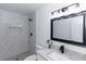 Updated bathroom with walk-in shower, modern fixtures, and decorative accents at 657 Lear Ter, Deltona, FL 32725