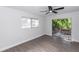 Bedroom with sliding glass door to outside area and ceiling fan at 657 Lear Ter, Deltona, FL 32725