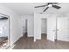 Bedroom view showing closet and bathroom doors, plus ceiling fan at 657 Lear Ter, Deltona, FL 32725