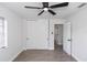 Bright bedroom with ceiling fan and closet with sliding doors at 657 Lear Ter, Deltona, FL 32725