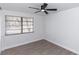 Well lit bedroom featuring ceiling fan and bright window at 657 Lear Ter, Deltona, FL 32725