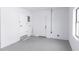 A clean garage space featuring two doors and concrete flooring, creating a utilitarian area at 657 Lear Ter, Deltona, FL 32725