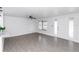 Bright, open living room with tile floors, contemporary lighting, and a welcoming atmosphere at 657 Lear Ter, Deltona, FL 32725