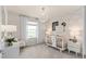 Charming Bedroom with soft, neutral colors, a rocking chair, and adorable wall art at 7262 Summer Ivy Aly, Orlando, FL 32829
