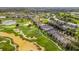 Aerial view of neighborhood, golf course and housing at 7411 Excitement Dr, Reunion, FL 34747